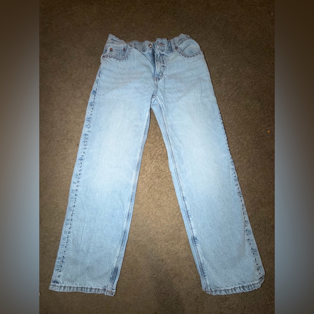 American Eagle Women's Light Blue Straight Leg Jeans with Silver Stud Detail.
